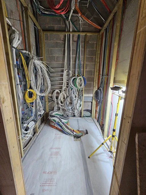 Equipment room with cabling sorted into organised runs during installation