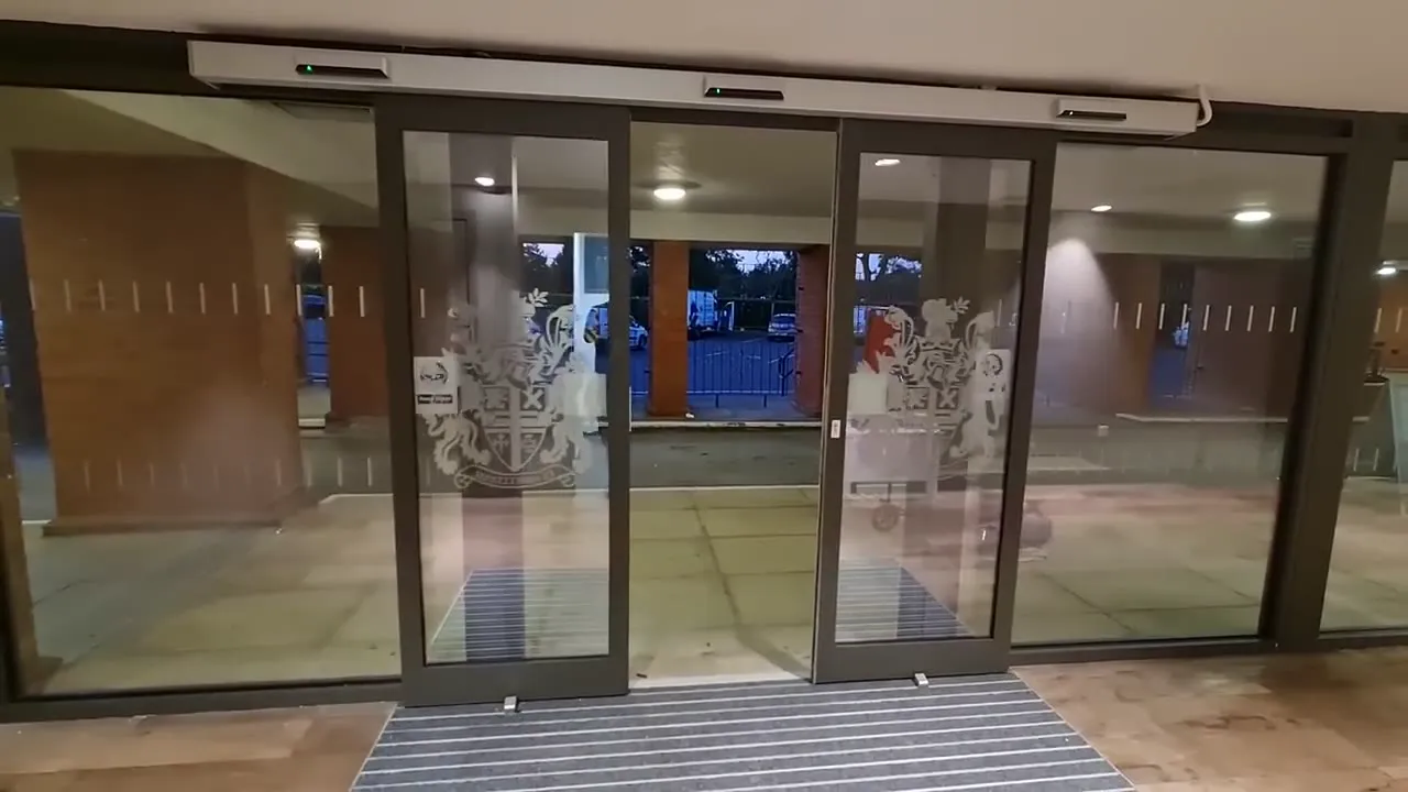 Automatic sliding glass entrance doors