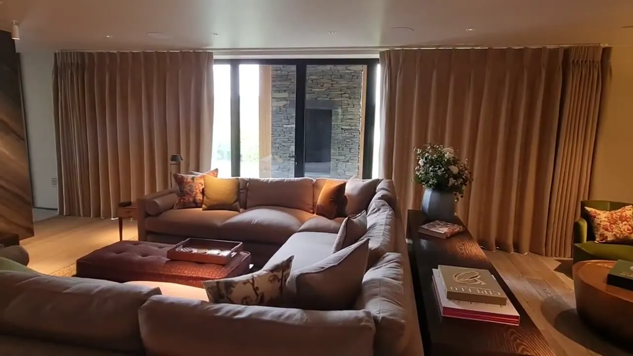 Full-length curtains on a motorised track in a living room