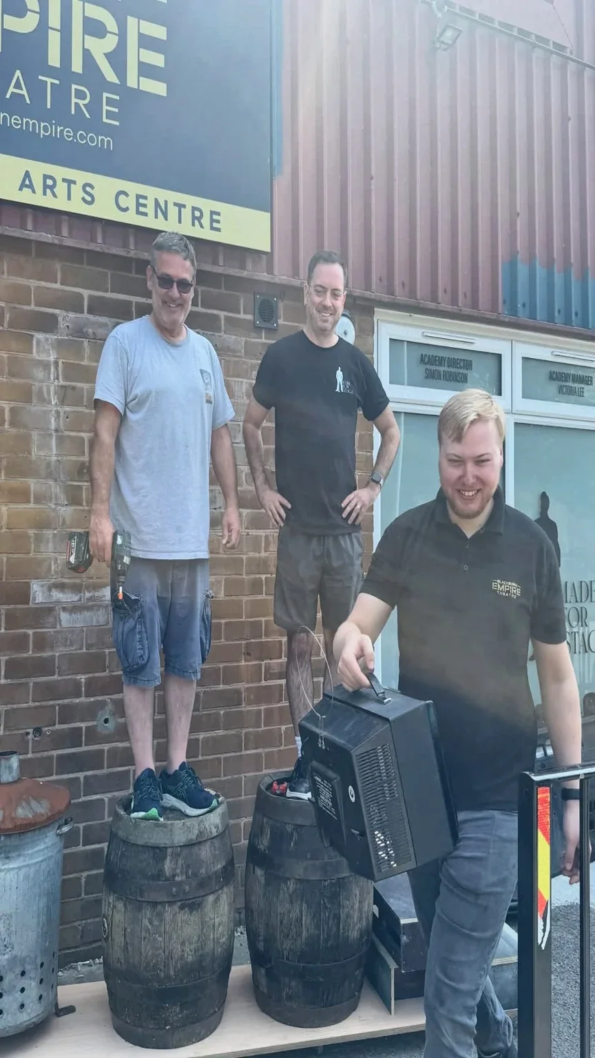 Crew during preparation of stage props outside the theatre venue