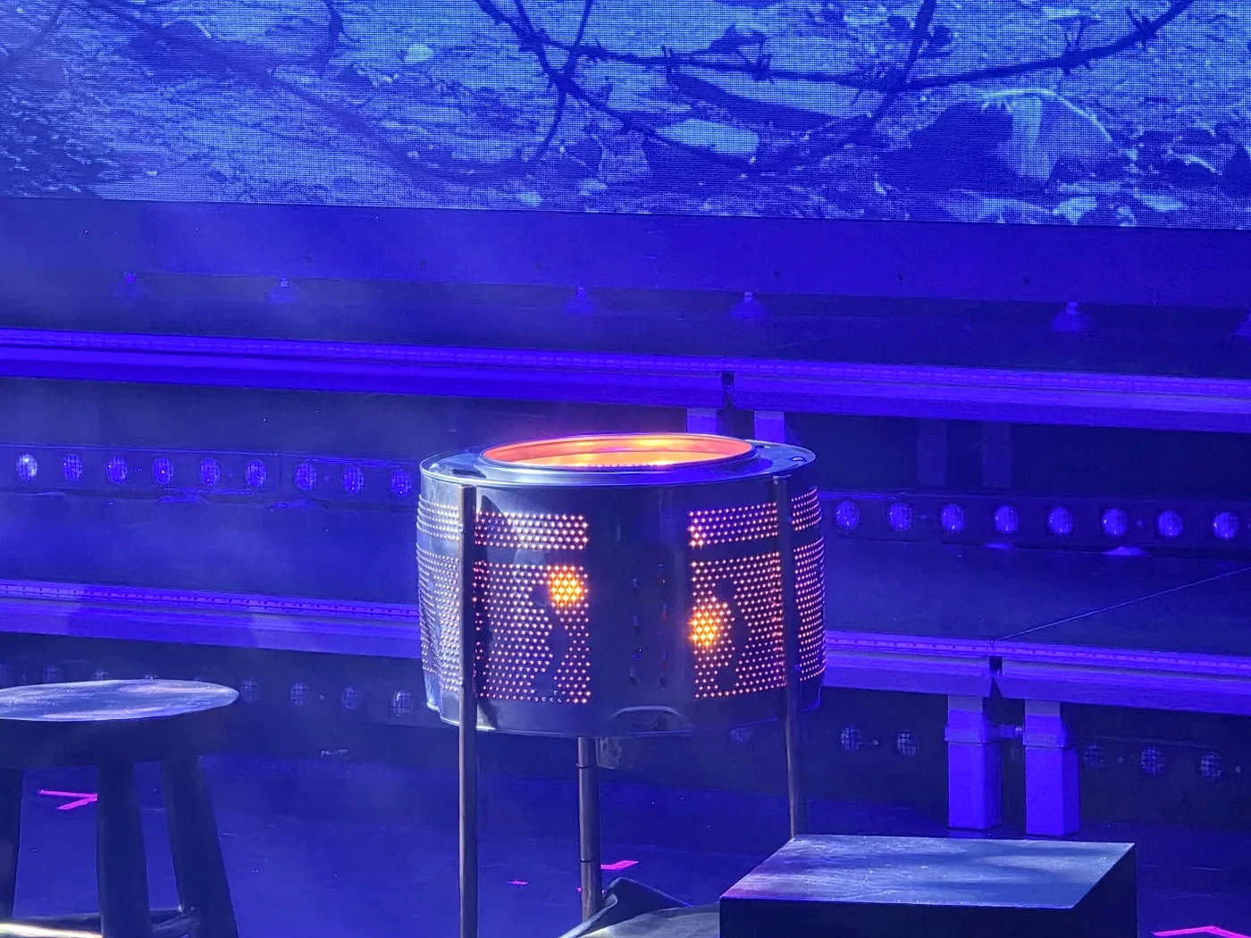 Close-up of illuminated fabricated theatre firepit
