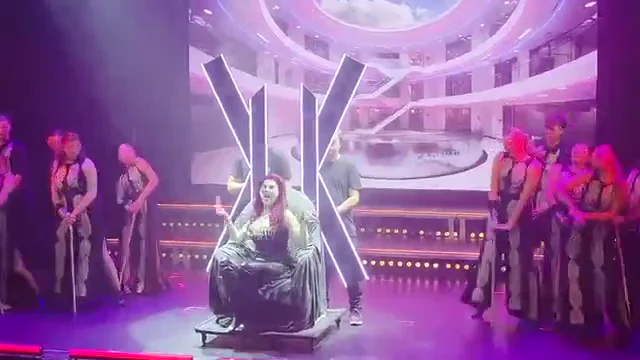Illuminated throne, cast and projected scenery during the live stage performance, extracted from project video